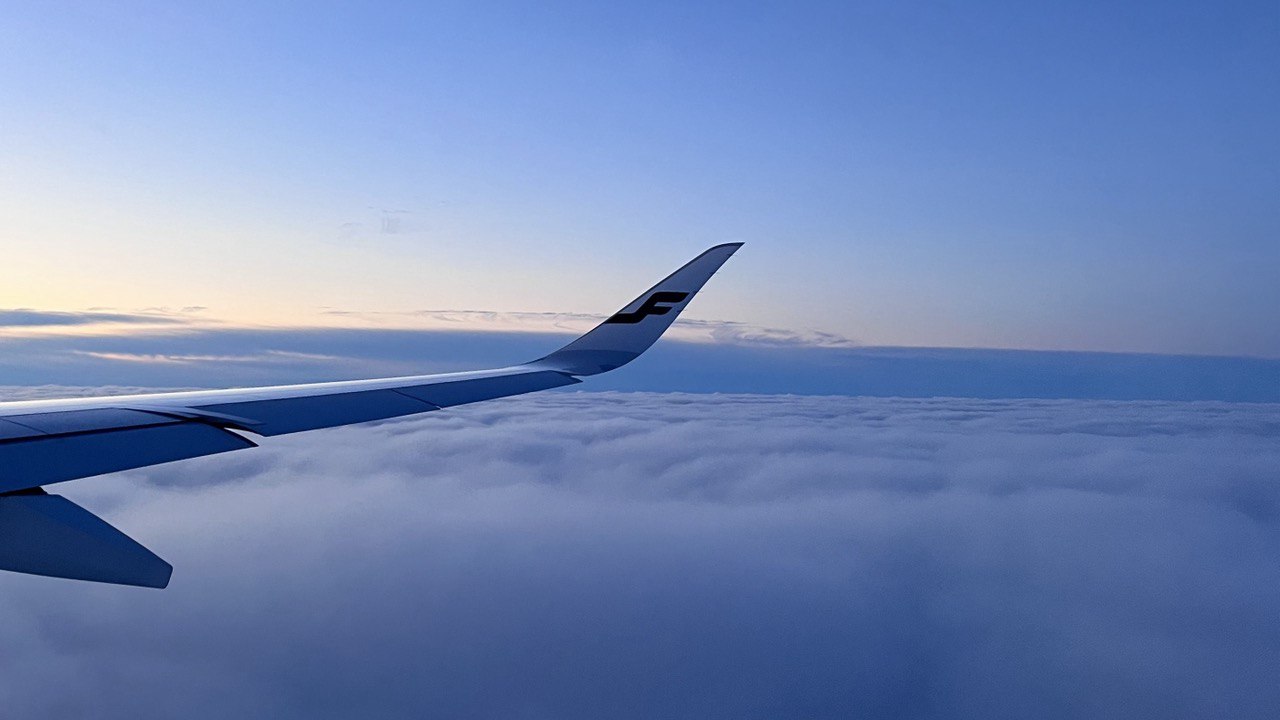 Picture of Finnair wing above the clouds