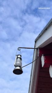 Lantern hanging off a red roof